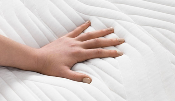 hand on mattress